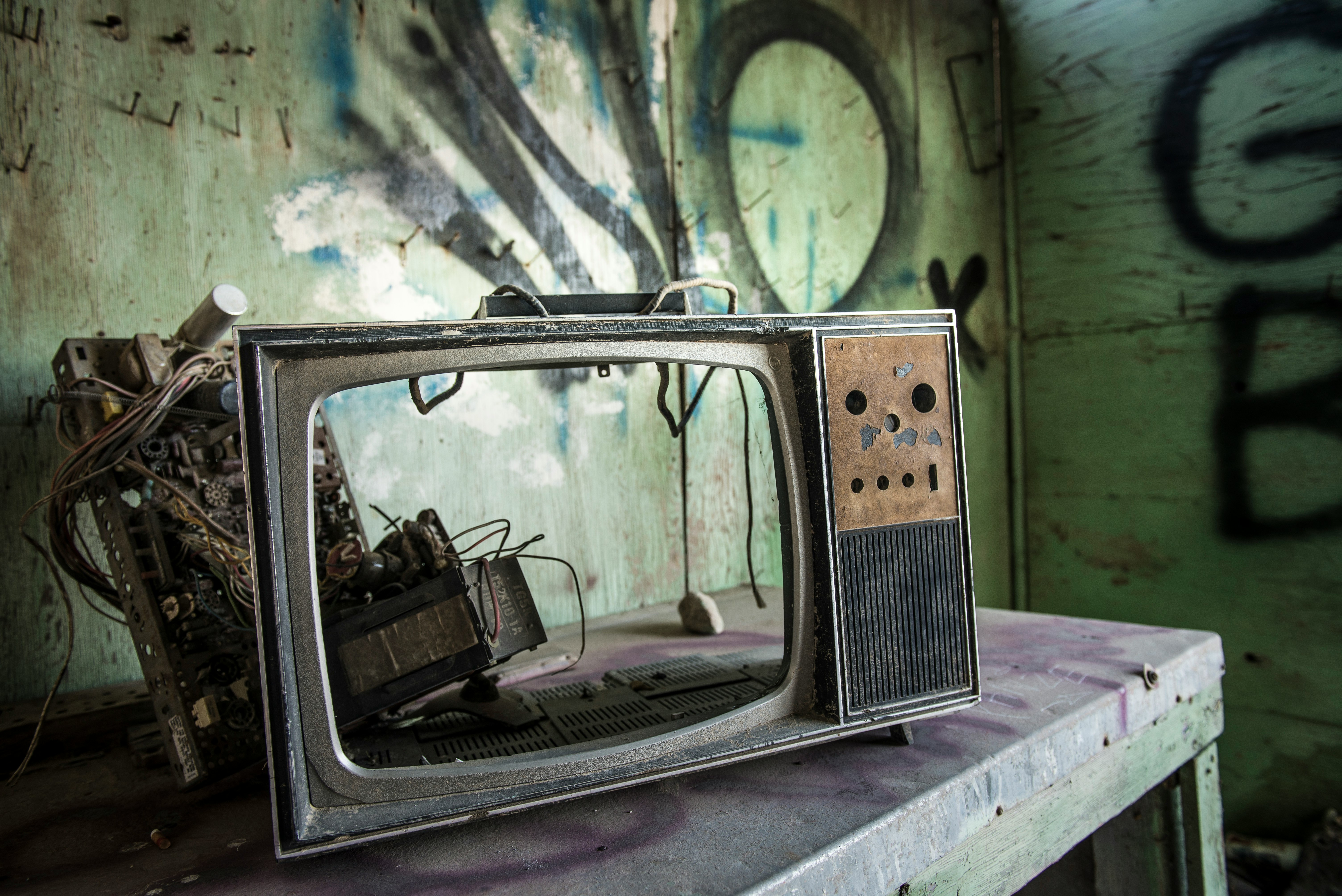 vintage TV on gray wooden table inside room